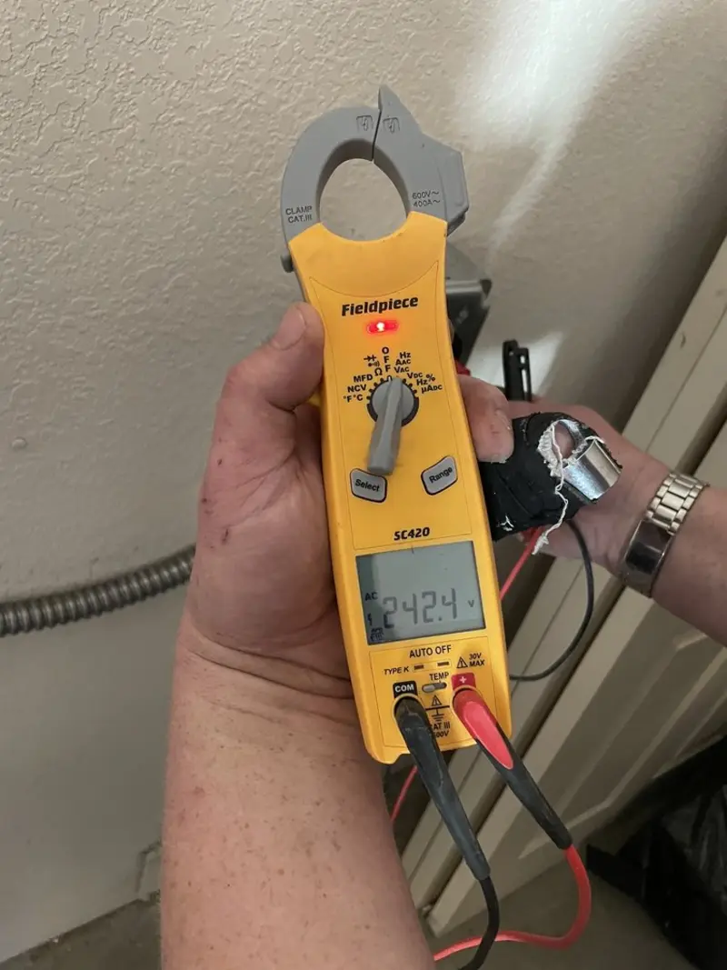 Voltage testing with clamp meter during Circuit Breaker Repair in Cuyahoga Falls